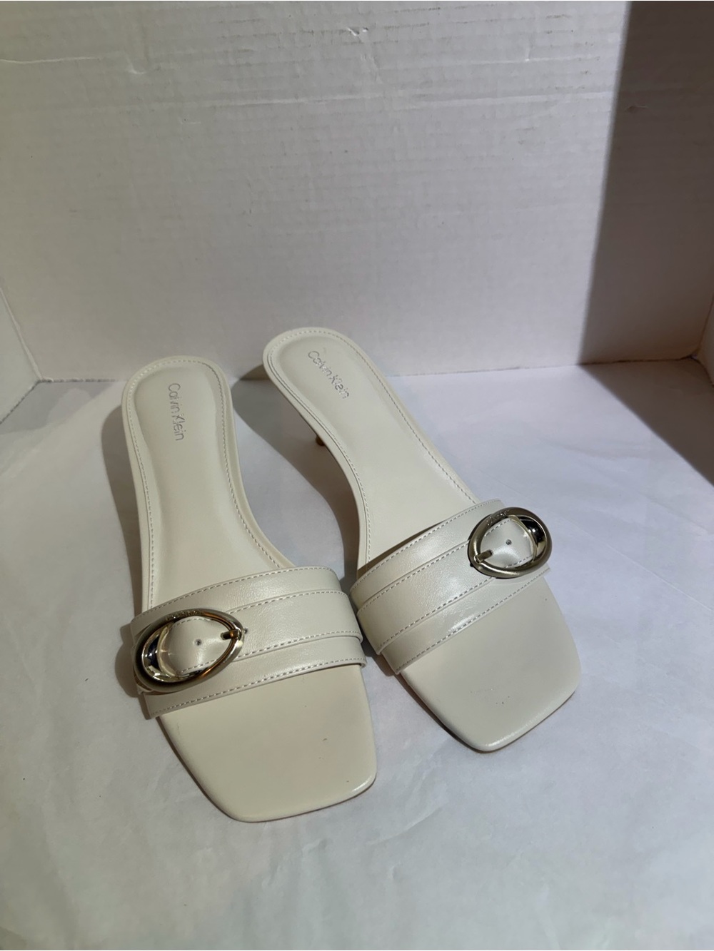 Calvin Klein Women's Off-White Slide Mules with Oval Silver Buckle